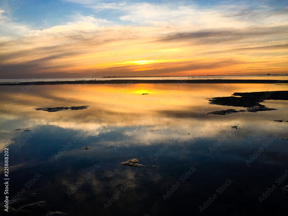 Beautiful Sunset at the Beach During Low Tide Beautiful Sunset at the Beach During Low Tide