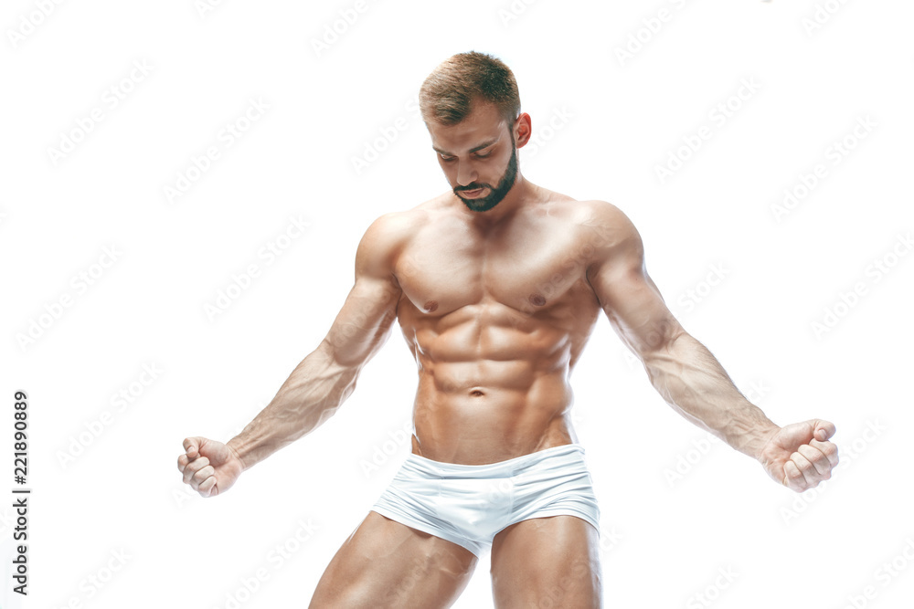 bodybuilder posing. Beautiful sporty guy male power. Fitness muscled manin white lingerie. on isolated white background.