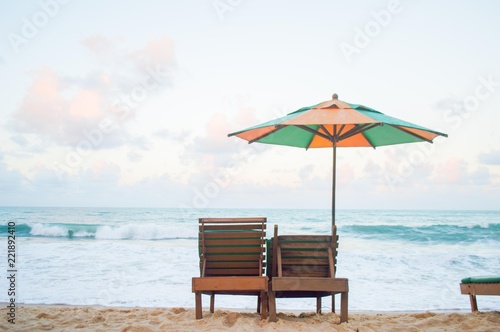 A lone umbrella on beautiful tropical sea. © Xiaoneng