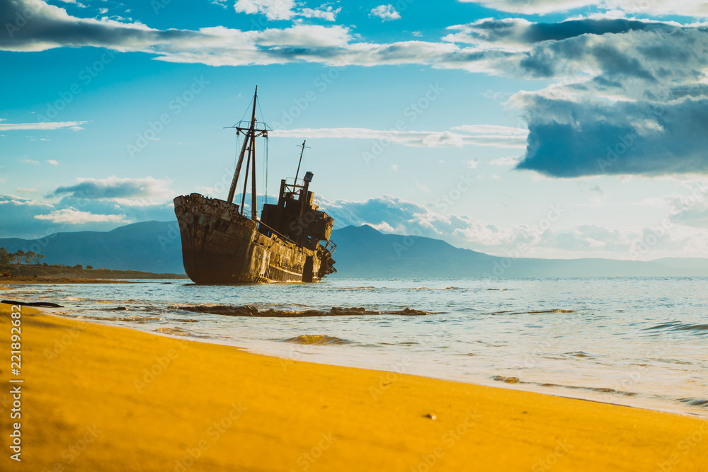 Rusty broken shipwreck on sea shore Rusty broken shipwreck on sea shore