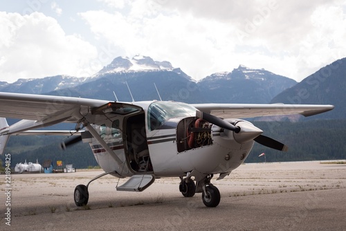 Aircraft parked for servicing near hangar photo