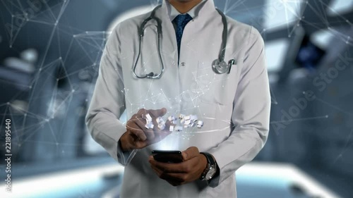 ATOMOXETINE HYDROCHLORIDE - Male Doctor With Mobile Phone Opens and Touches Hologram Word Active Ingrident of Medicine photo