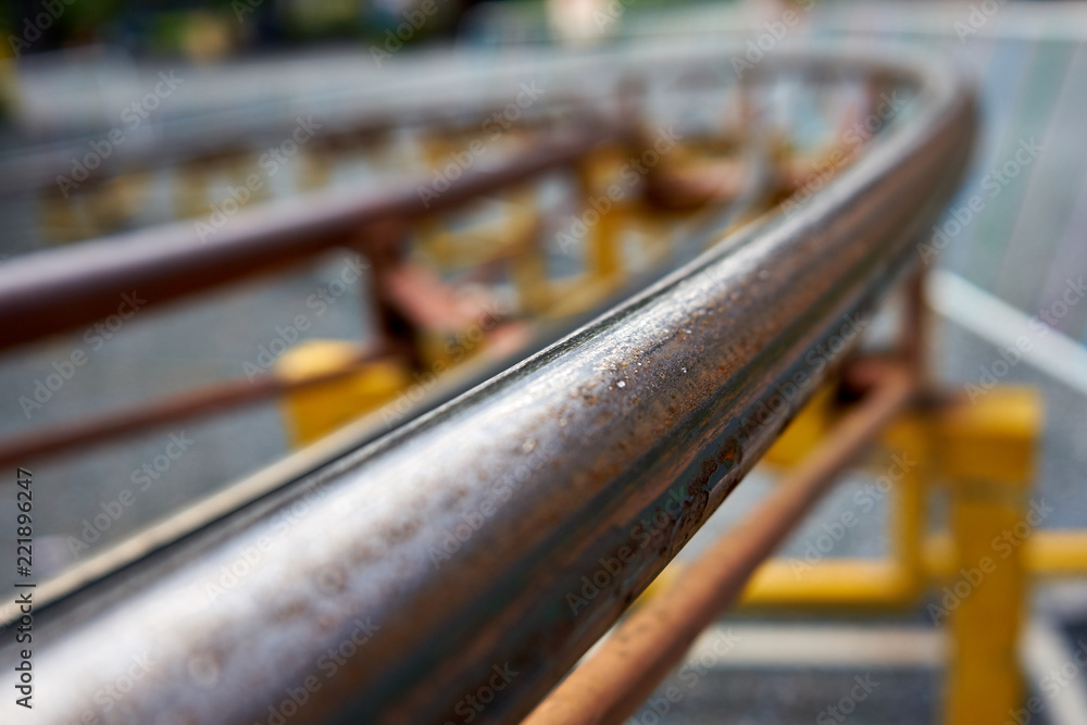 Detail Of a Curvy And Rusty Roller Coaster Rail Detail Of a Curvy And Rusty Roller Coaster Rail
