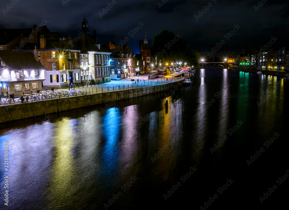 Night View Of York Along The River Ouse With Colourful Reflections  In The Water