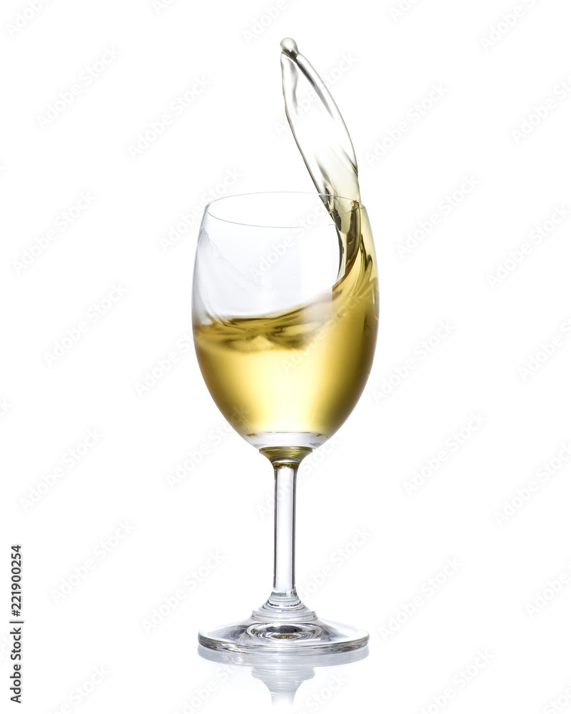 White wine splashing out of glass isolated on white background. White wine splashing out of glass isolated on white background.