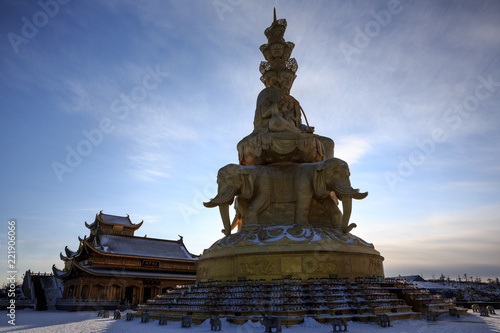 Emeishan, Mount Emei, Sichuan Province China. Sacred Buddhist Mountain. Snow Covered Mountain, Golden Elephant Statue, Shrine. Winter scenery, ice and snow. Silhouette, golden summit temple, religion