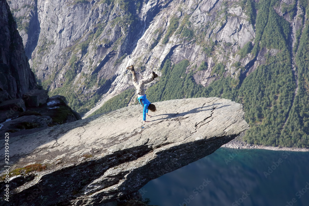 Naklejka premium man stands on his hands in Troll language. Norway