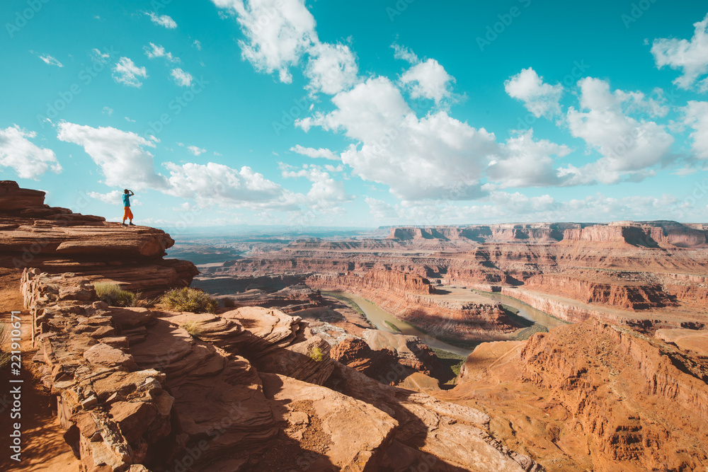 Hiker on a cliff in Dead Horse Point State Park, Utah, USA