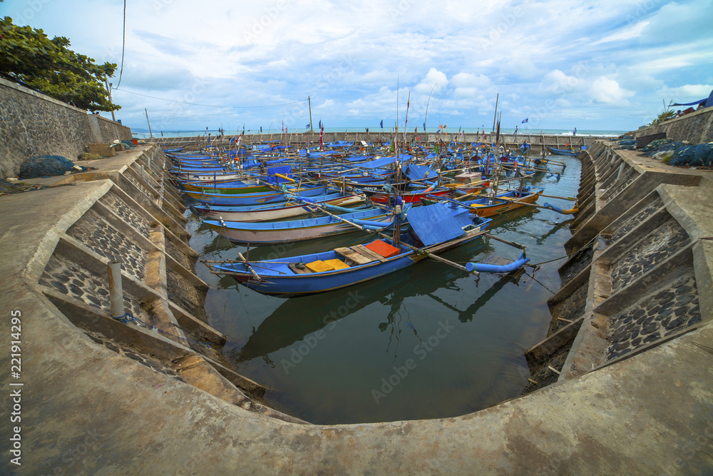 Cianjur west java Indonesia Small blue wooden fishing boats in the port on south coast