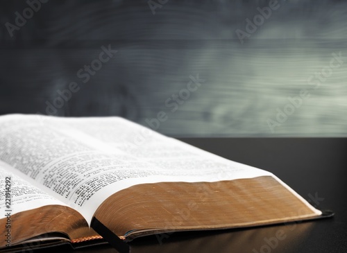 Holy bible book on wooden table