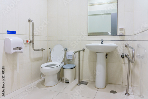 Toilet for the elderly and the disabled.It have two-sided handle for support the body and slip protection. Safety public toilet.