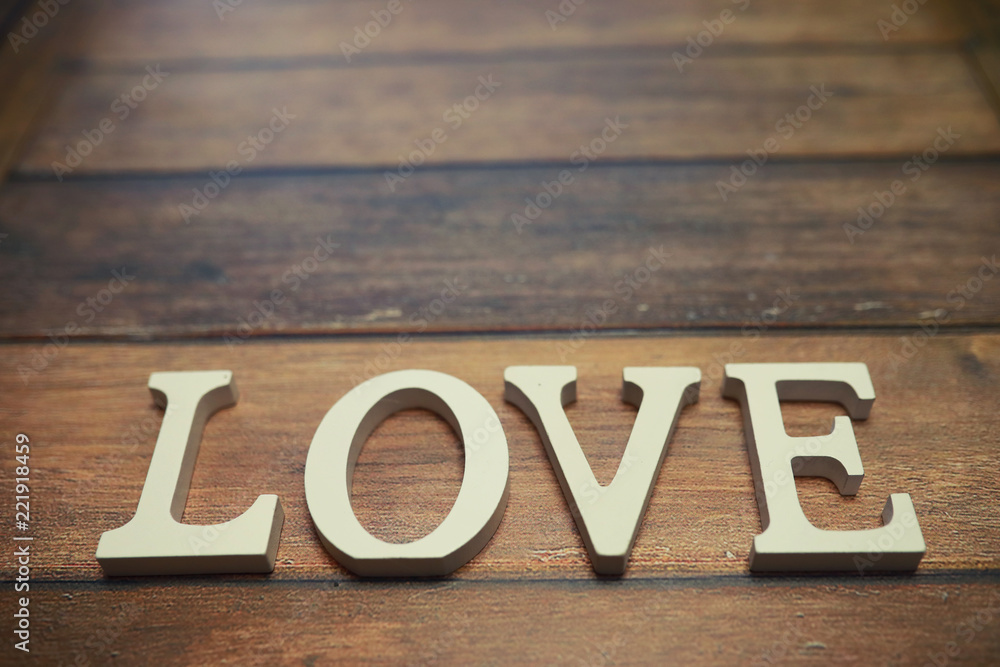 word Love from wooden letters on background word Love from wooden letters on background