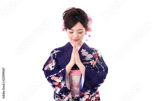 portrait of young asian woman wearing purple kimono on white background © taka