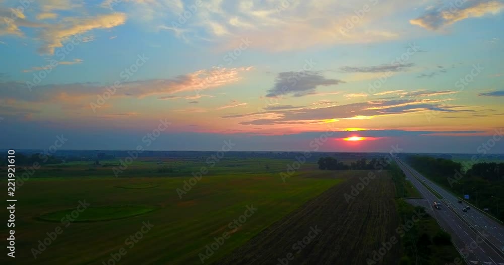 Summer Sunset Evening Above Countryside Rural Wheat Field Landscape. drone flight Summer Sunset Evening Above Countryside Rural Wheat Field Landscape. drone flight