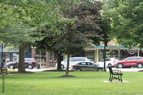 Фотография town square in rural area with traffic driving on the road