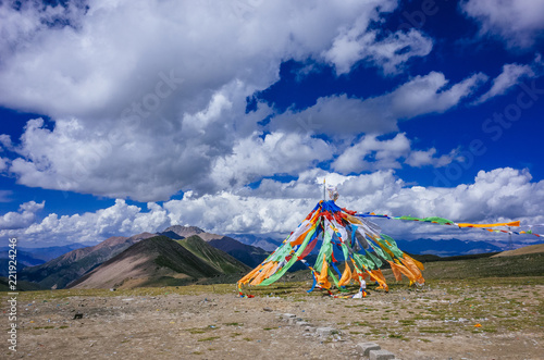 Tibetan prayer flags against mountains and landscape of Qinghai,