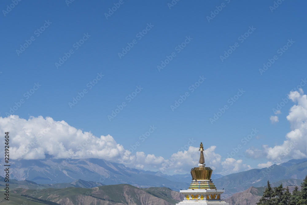 Tibetan pagoda against mountains and landscape of Qinghai, China