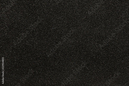 Black synthetic sponge texture for background