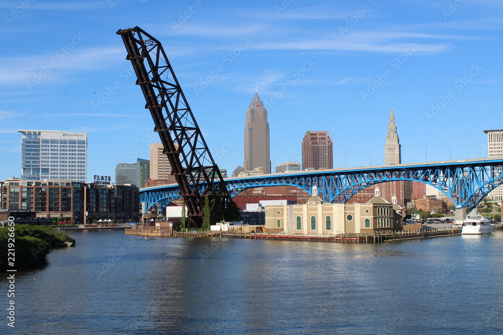 Naklejka premium cityscape by a river on a bright sunny day