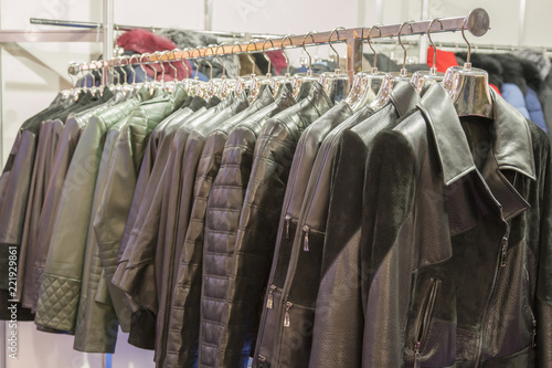 Leather jackets on the hangers at the store. Various leather jackets on the hangers at the store © jollier_