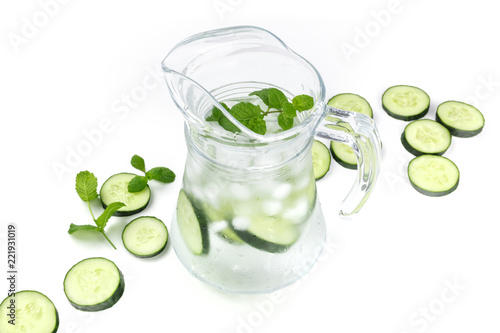 Cucumber and mint lemonade in a jar on a white background with copyspace