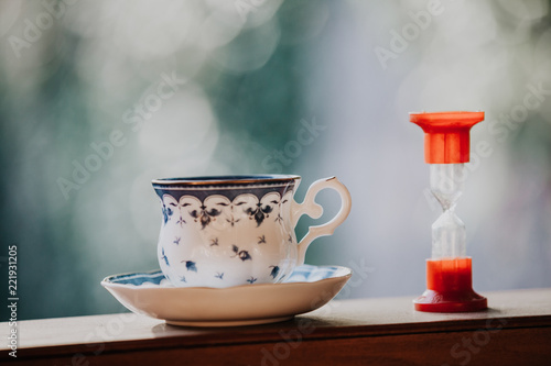 Elegant tea cup and hourglass stand shelf