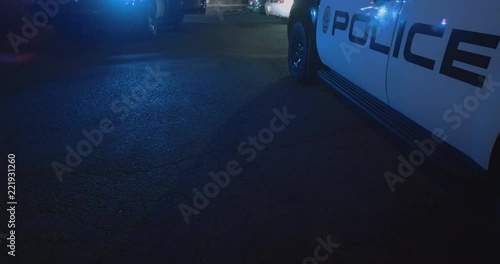 police cars in parking lot with lights on