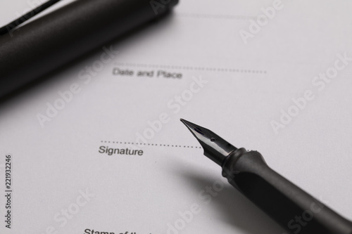 The pen is on the contract for signing business concept