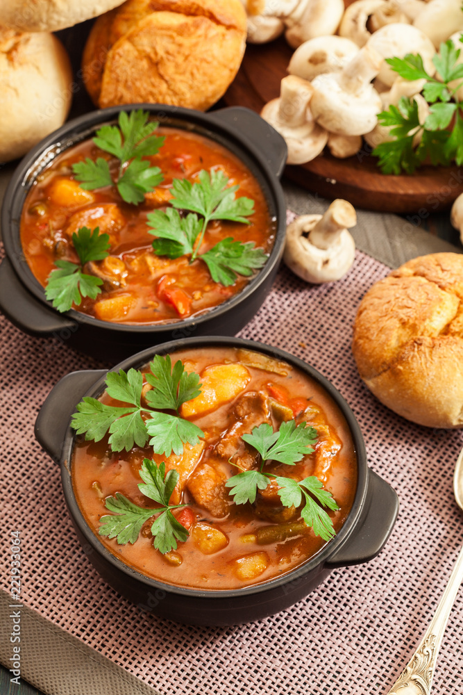 Stew soup with meat, potatoes, mushrooms and red pepper Stew soup with meat, potatoes, mushrooms and red pepper