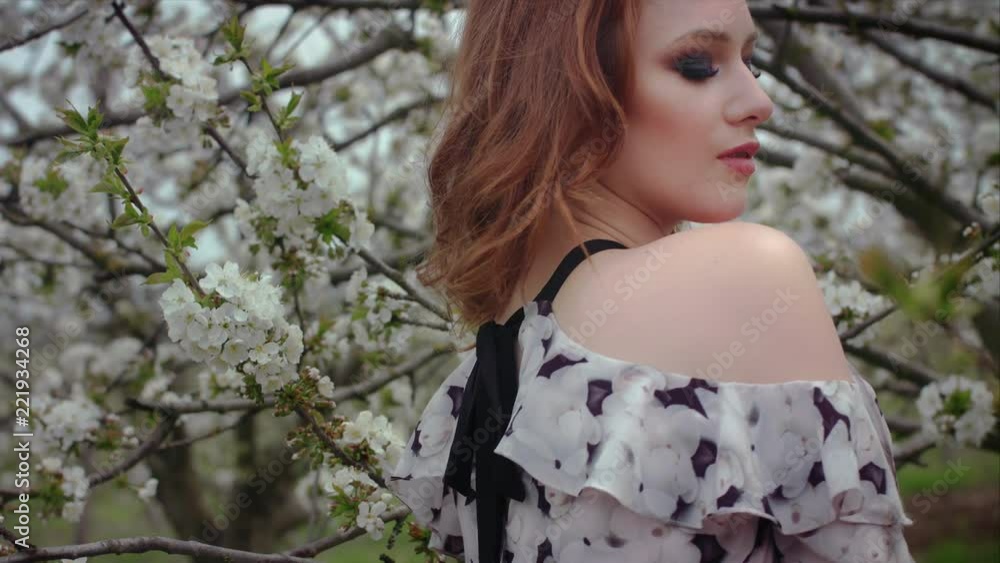 girl posing near blooming trees girl posing near blooming trees