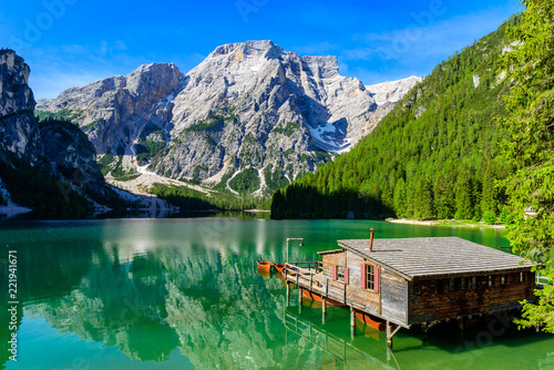 Lake Braies (also known as Pragser Wildsee or Lago di Braies) in Dolomites Mountains, Sudtirol, Italy. Romantic place with typical wooden boats on the alpine lake. Hiking travel and adventure. 