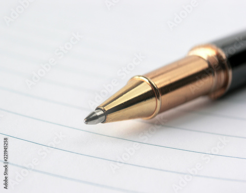 close up.stylish ballpoint pen on notebook sheet