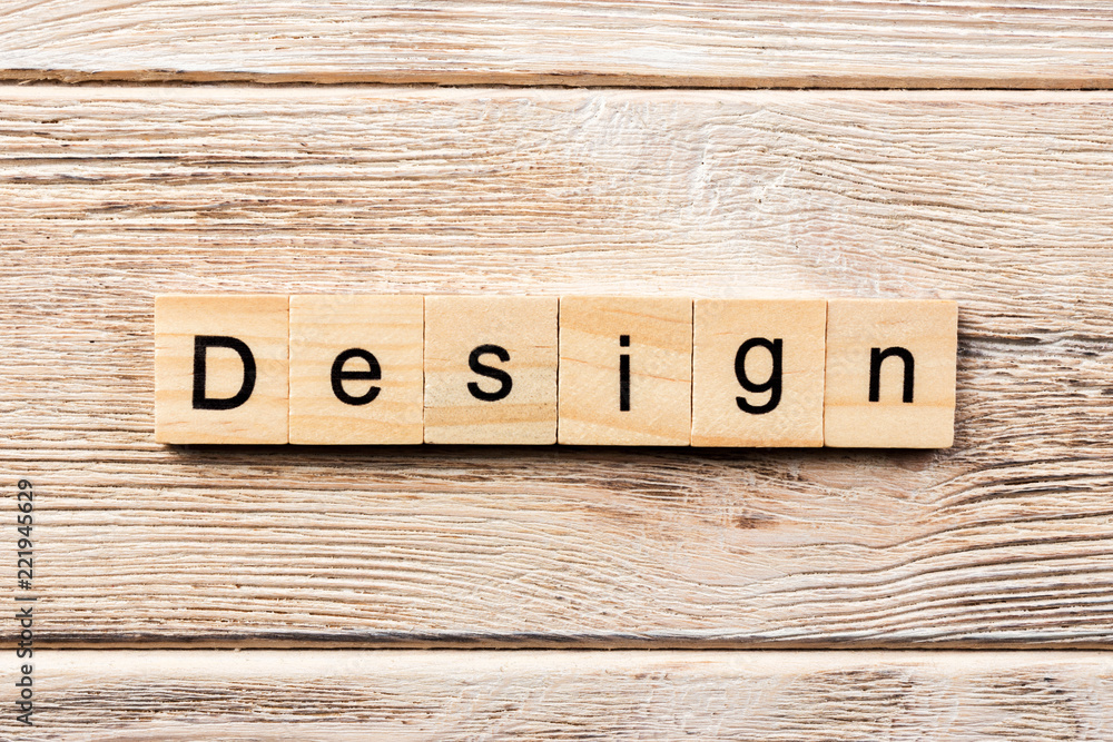 Fototapeta premium design word written on wood block. design text on table, concept
