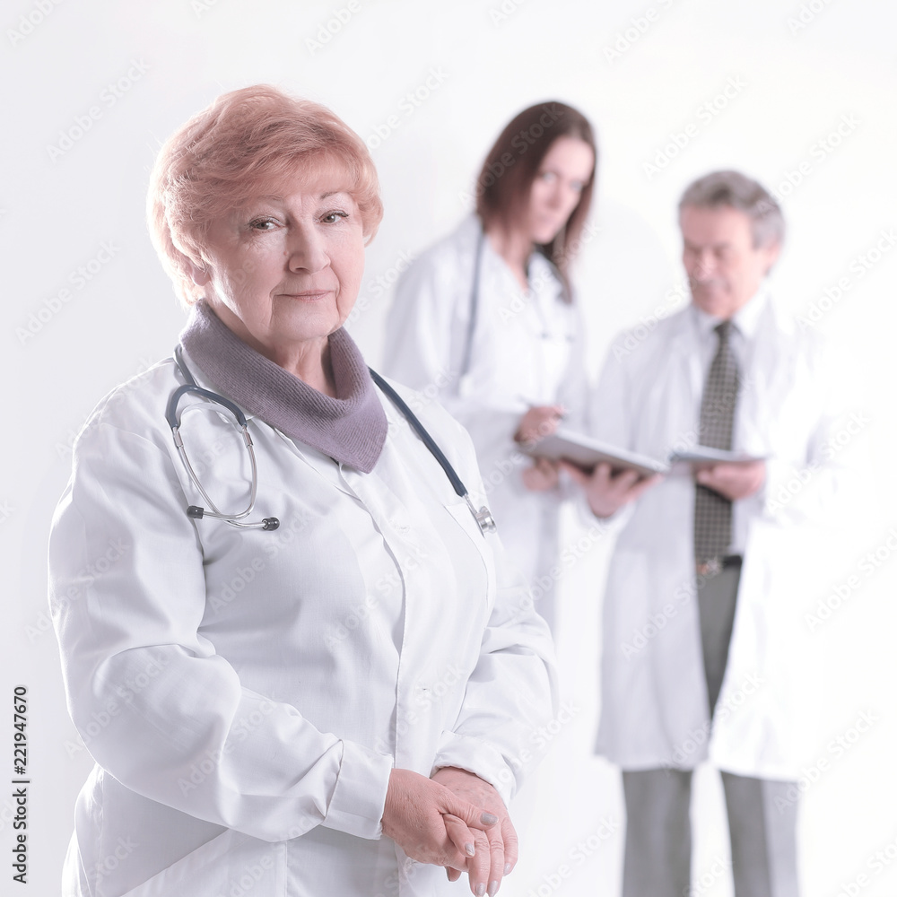 adult female doctor therapist on blurred background of colleagues adult female doctor therapist on blurred background of colleagues