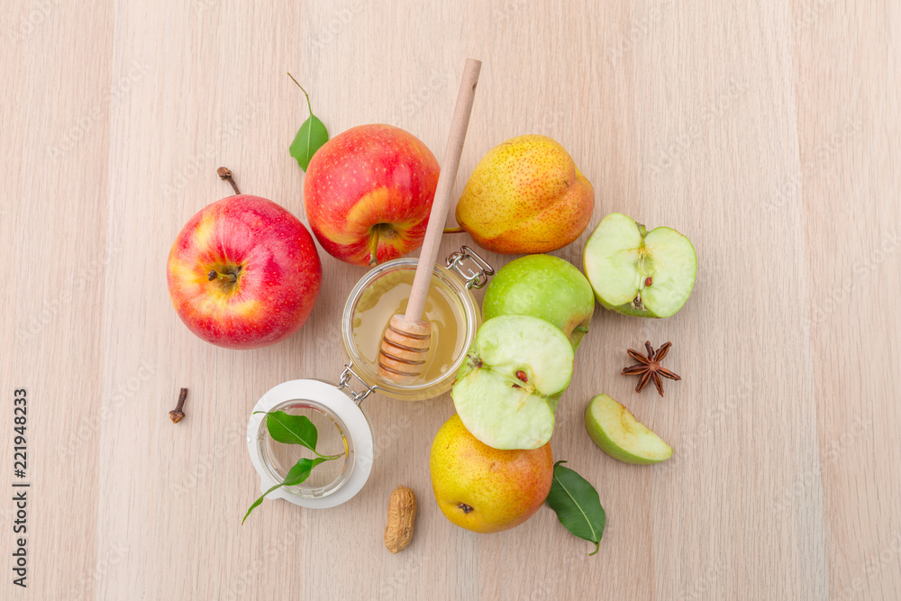 Jewish holiday Rosh Hashanah background with honey and apples on wooden table. Jewish holiday Rosh Hashanah background with honey and apples on wooden table.
