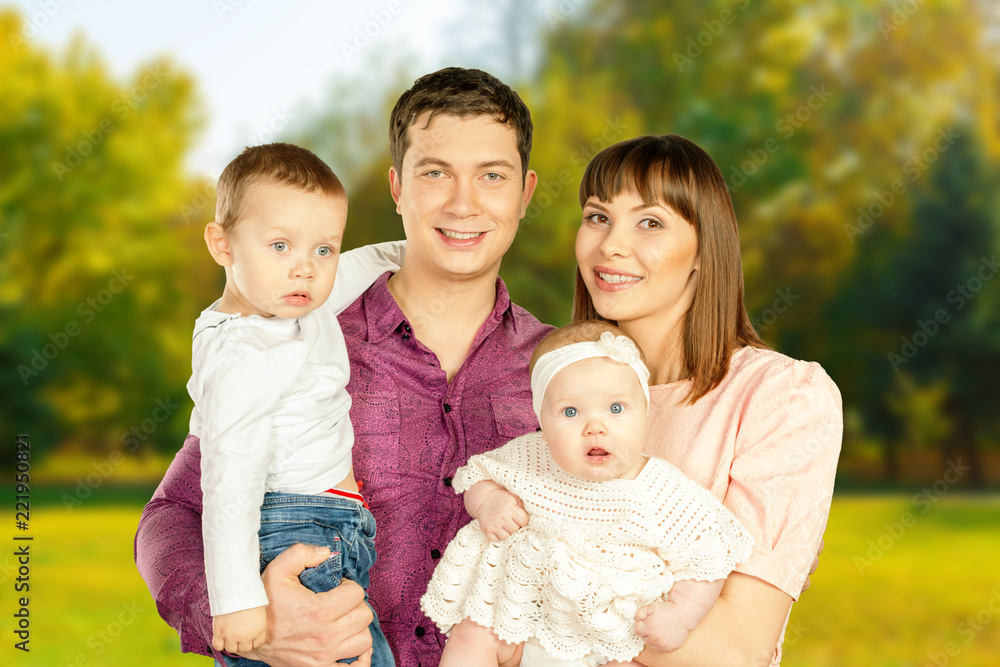 happy family in autumn park enjoying their time