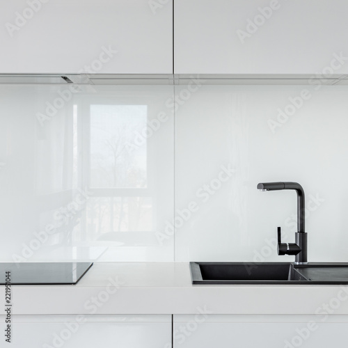 White kitchen with black sink