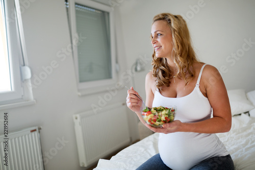 Portrait of pregnant woman eating healthy food