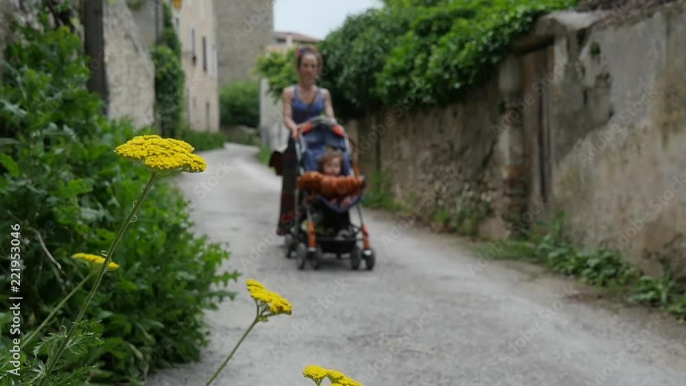 Mom walks baby in the stroller