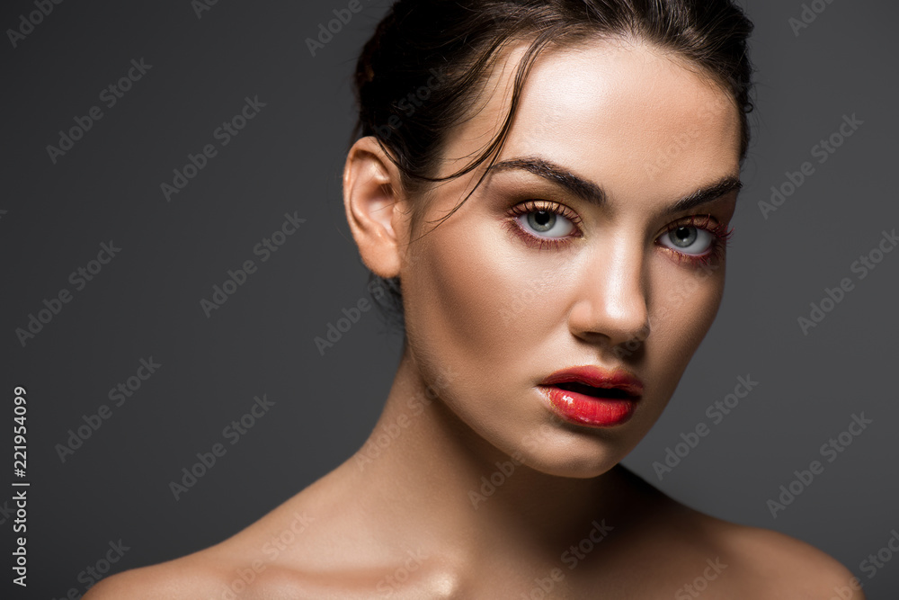 attractive stylish girl with makeup posing for fashion shoot, isolated on grey attractive stylish girl with makeup posing for fashion shoot, isolated on grey