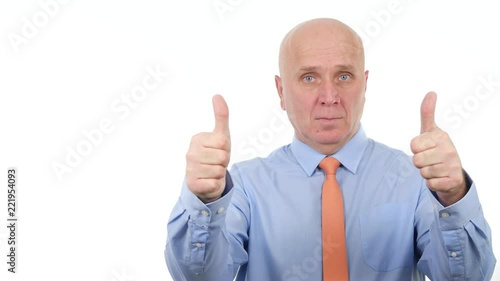 Trustful Businessman Stay Serious and Make Double Thumbs Up Means Good Job photo