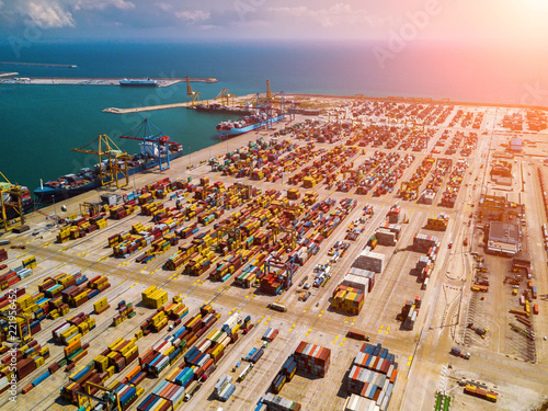 Industrial Cargo area with container ship in dock at port, Aerial view photo