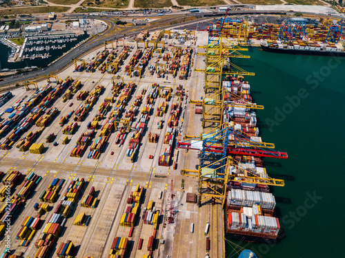 Industrial Cargo area with container ship in dock at port, Aerial view photo