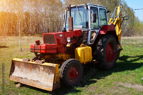 old universal tractor on a green grass