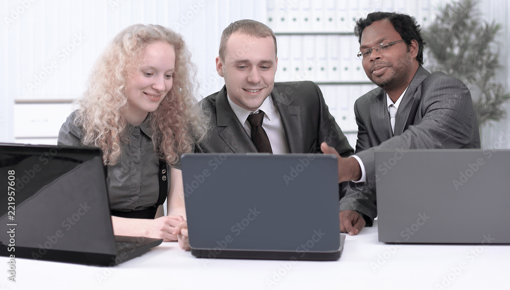 business team discussing business issues in office. business team discussing business issues in office.