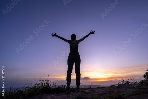 Woman successful hiking climbing silhouette in mountains © pigprox