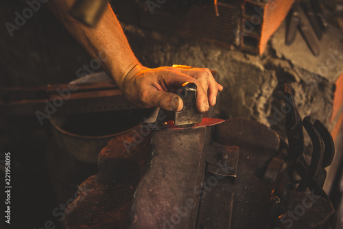 Crop man forging blade photo