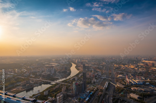 Aerial top view of Moscow city panorama at sunset  river and bridges  roads and buildings in evening myst