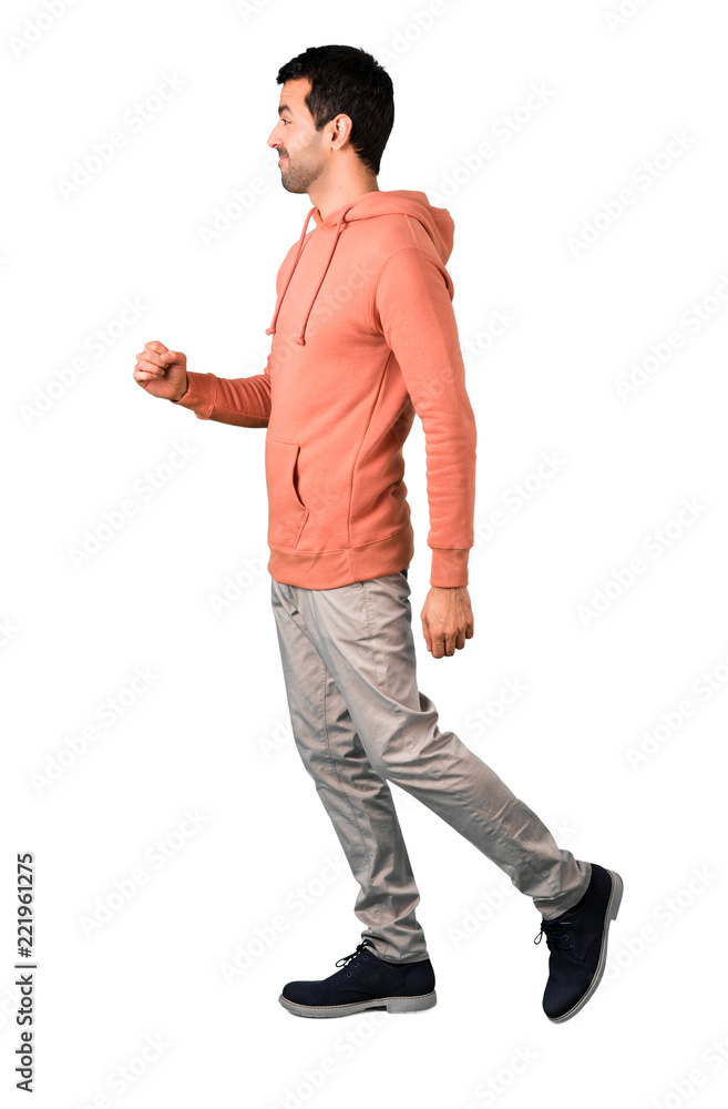 Naklejka premium Full body of Man in a pink sweatshirt walking. Motion gesture on isolated white background. Ideal for use in architectural designs