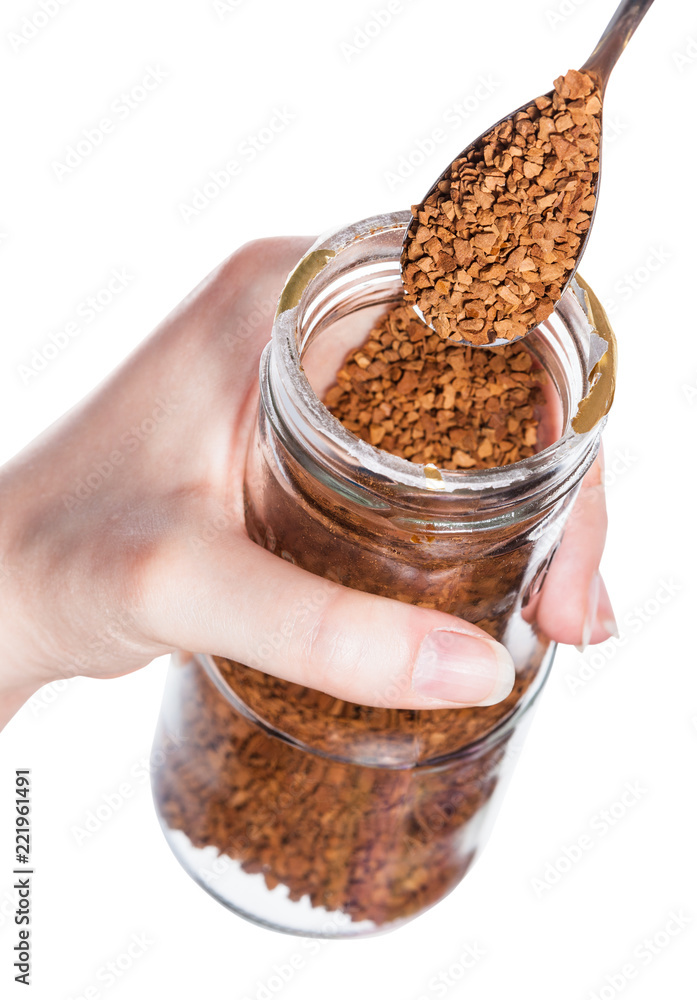 spoon scoops up coffee crystals from glass jar Stock Photo Adobe Stock
